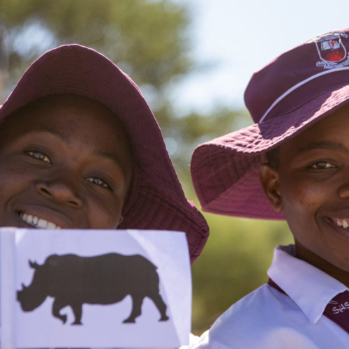 Schoolchildren eagerly waiting to see the rhinos arriving in the Tsholotsho communal lands
