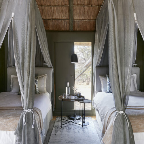 interior of a luxury bedroom at Victoria Falls River Lodge