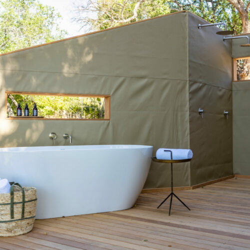 outdoor bath and shower at Victoria Falls River Lodge