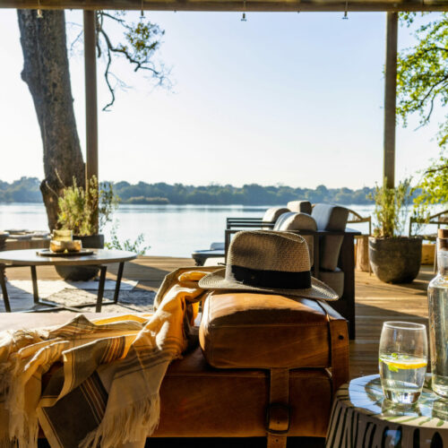 water carafe and couch on the deck at Victoria Falls River Lodge