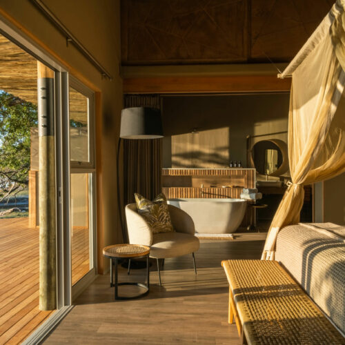 Golden sunlight streaming into a suite at the Victoria Falls River Lodge